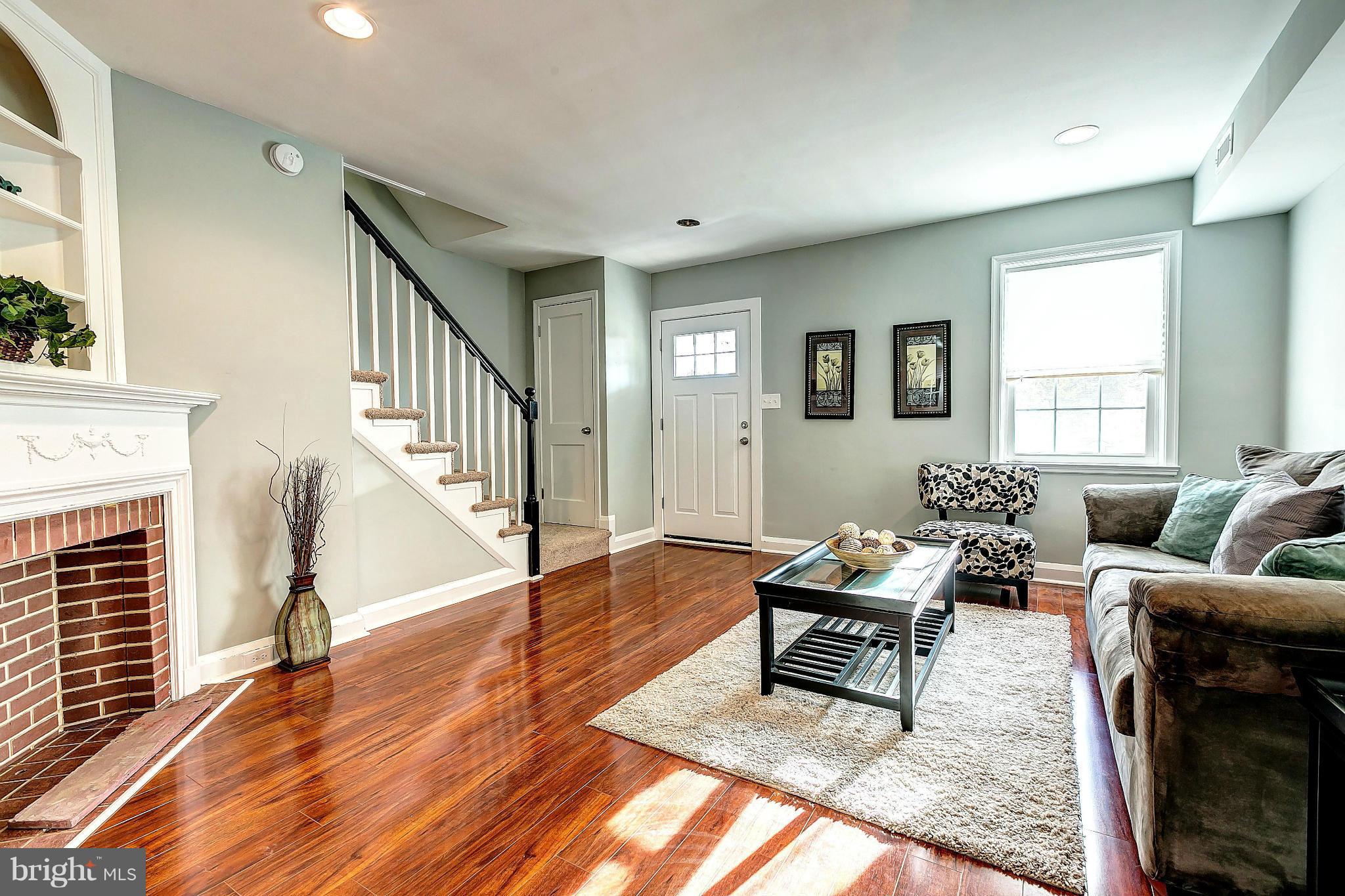 968 North Hill Road Baltimore, MD 21218 - Photo 1 of 29 a living room with furniture and a fireplace