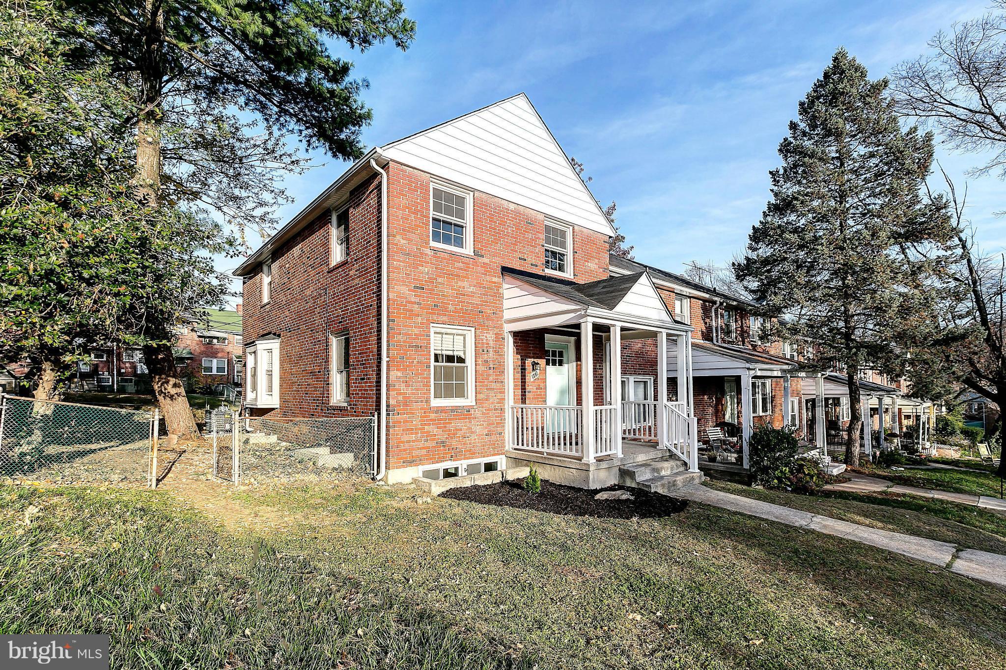 968 North Hill Road Baltimore, MD 21218 - Photo 2 of 29 a front view of a house with a yard