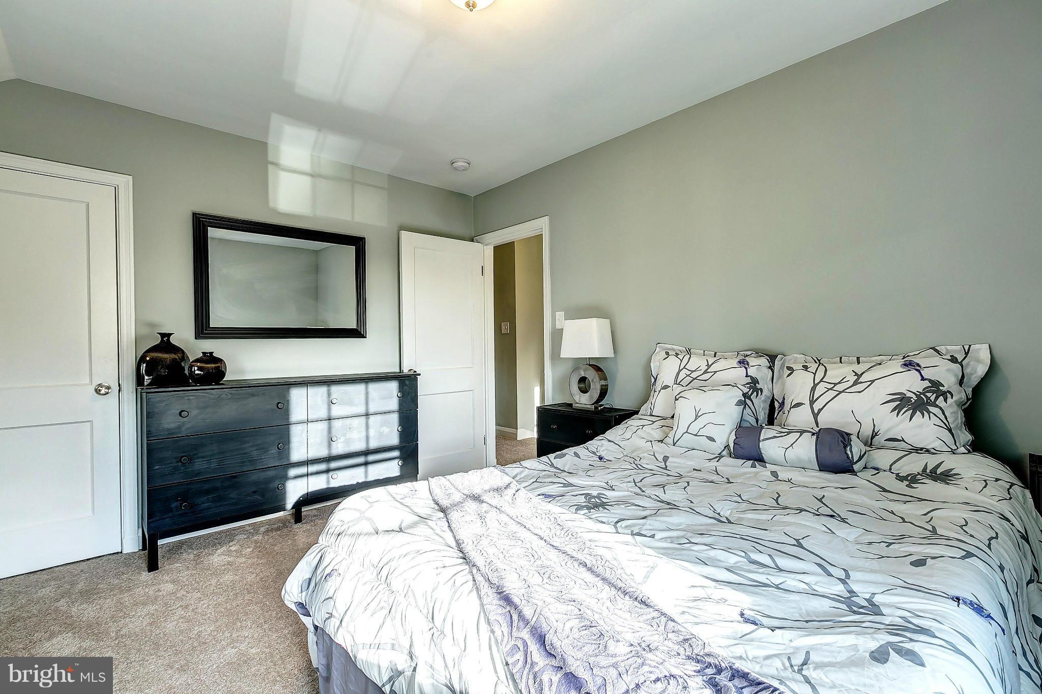 968 North Hill Road Baltimore, MD 21218 - Photo 14 of 29 a bedroom with a bed and a tv