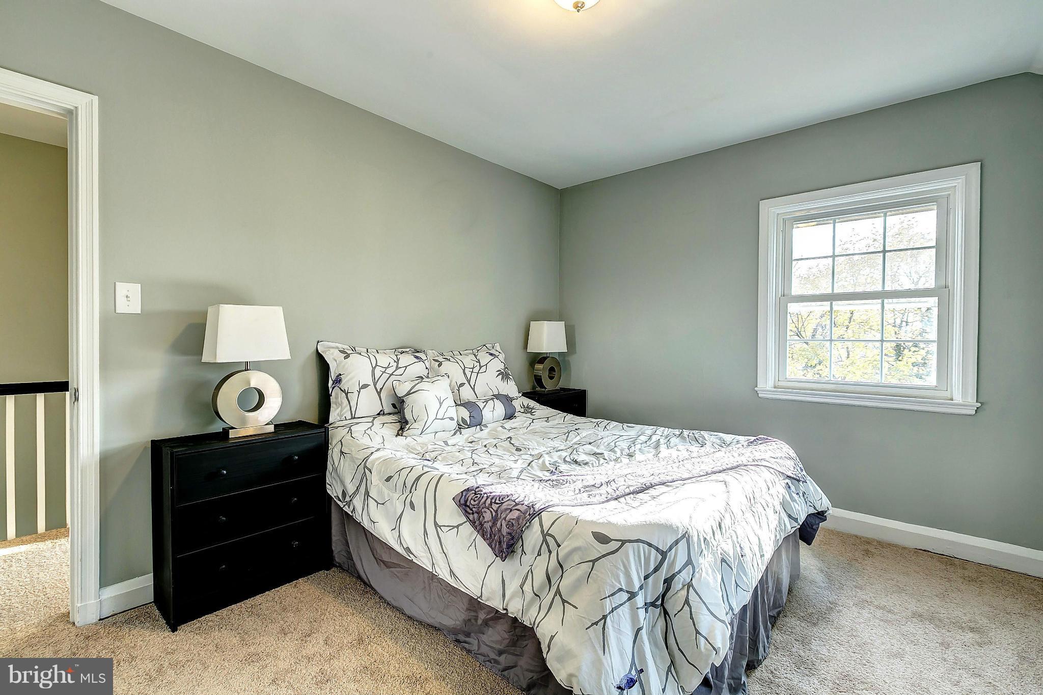 968 North Hill Road Baltimore, MD 21218 - Photo 15 of 29 a bedroom with a bed and window