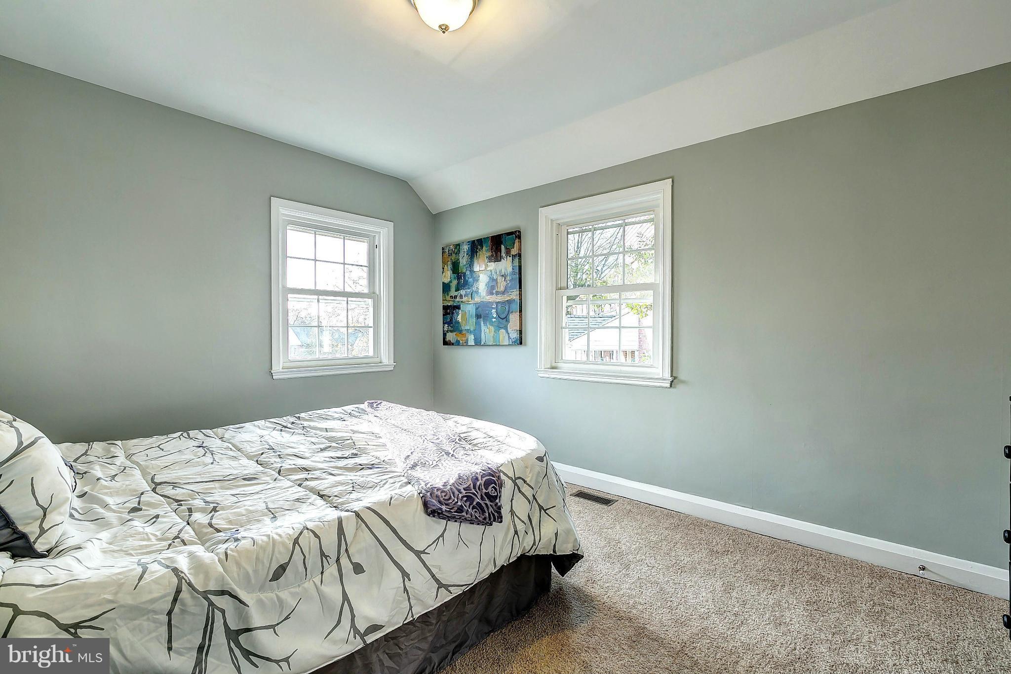 968 North Hill Road Baltimore, MD 21218 - Photo 16 of 29 a bedroom with a bed and a window