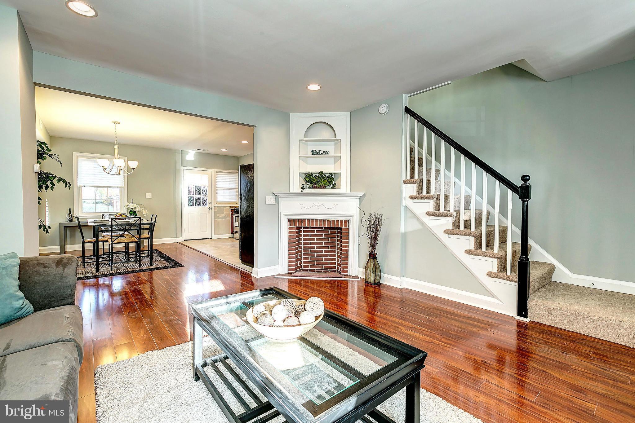 968 North Hill Road Baltimore, MD 21218 - Photo 3 of 29 a living room with furniture and wooden floor