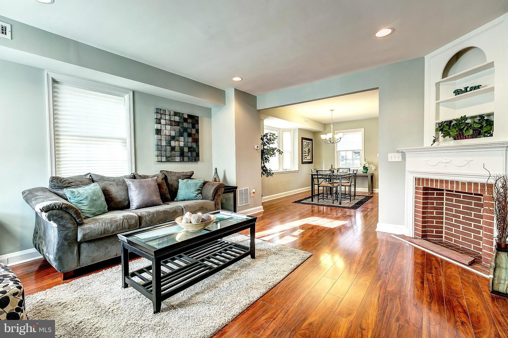 968 North Hill Road Baltimore, MD 21218 - Photo 6 of 29 a living room with furniture and a fireplace