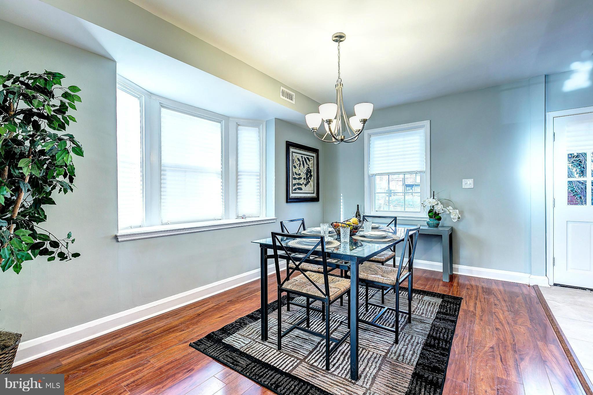 968 North Hill Road Baltimore, MD 21218 - Photo 9 of 29 a view of a dining room with furniture window and wooden floor