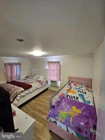 a bedroom with bed and a window