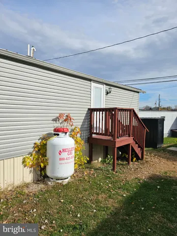 a view of a chairs and table in backyard