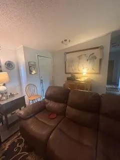 a projector room with furniture and a lamp