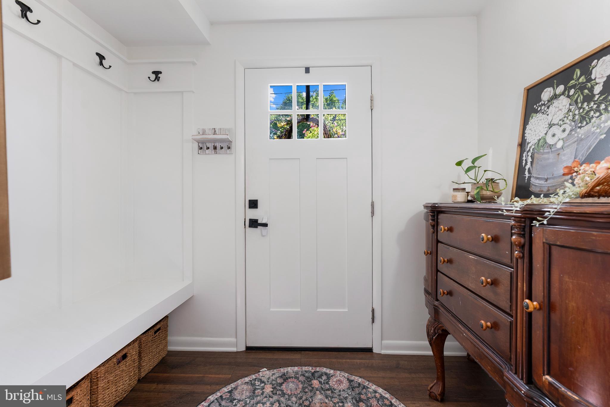 6222 Groveland Road Linthicum Heights, MD 21090 - Photo 6 of 40 a view of room with painting on the wall and a potted plant