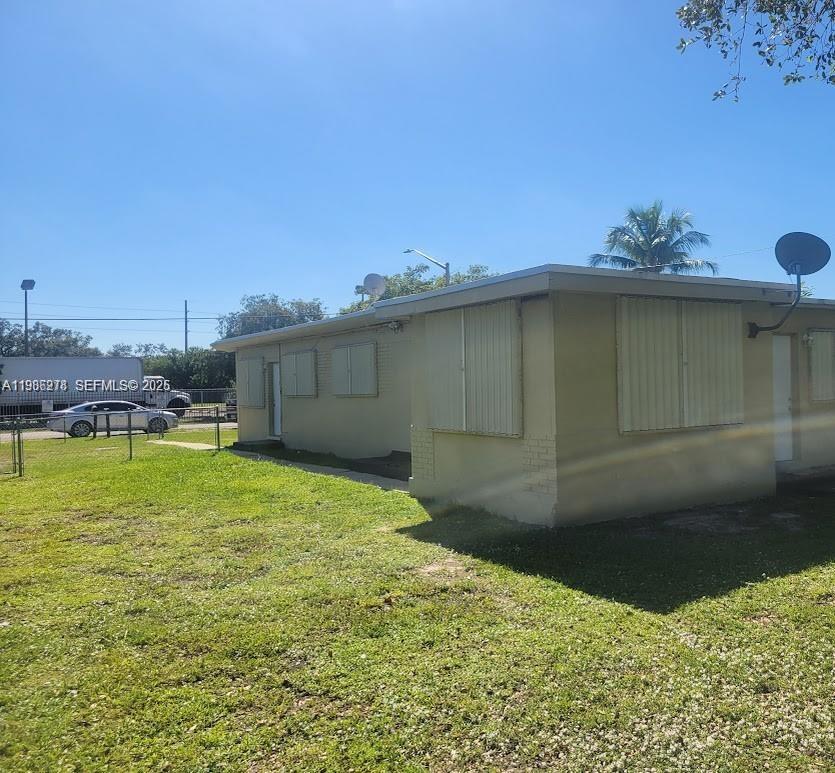 751 Northwest 96th Street, Unit 751 Miami, FL 33150 - Photo 9 of 11 a backyard of a house