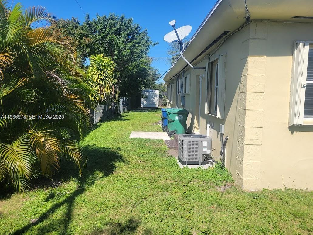 751 Northwest 96th Street, Unit 751 Miami, FL 33150 - Photo 10 of 11 a view of a house with a backyard
