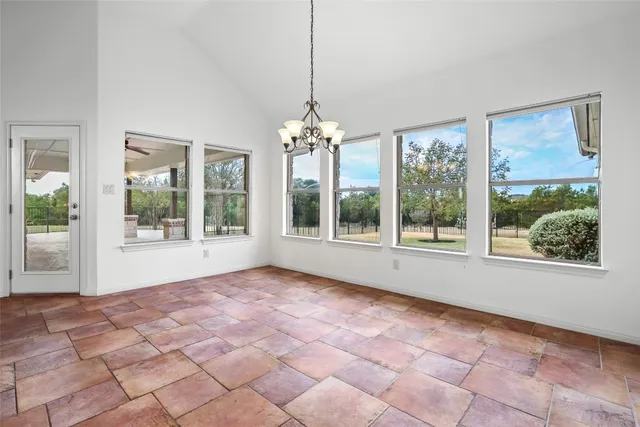 a kitchen with stainless steel appliances kitchen island granite countertop a stove a sink and a refrigerator