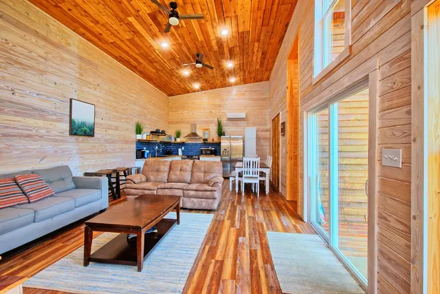 a balcony with furniture and wooden floor