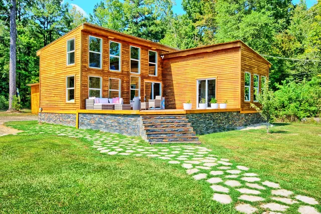 a front view of a house with a yard