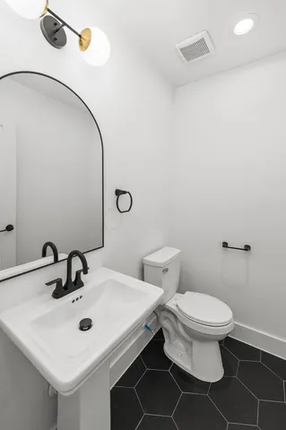 a bathroom with a sink and a toilet