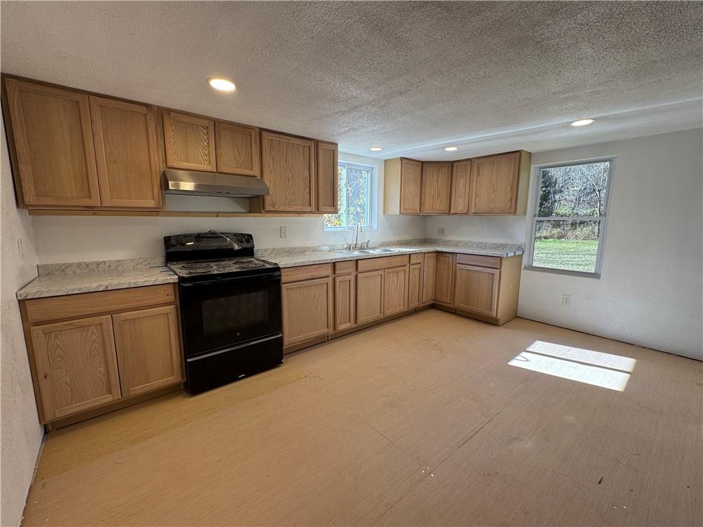 2505 Parkwood Road Shelocta, PA 15774 - Photo 2 of 19 a kitchen with stainless steel appliances granite countertop a stove a sink dishwasher and a refrigerator