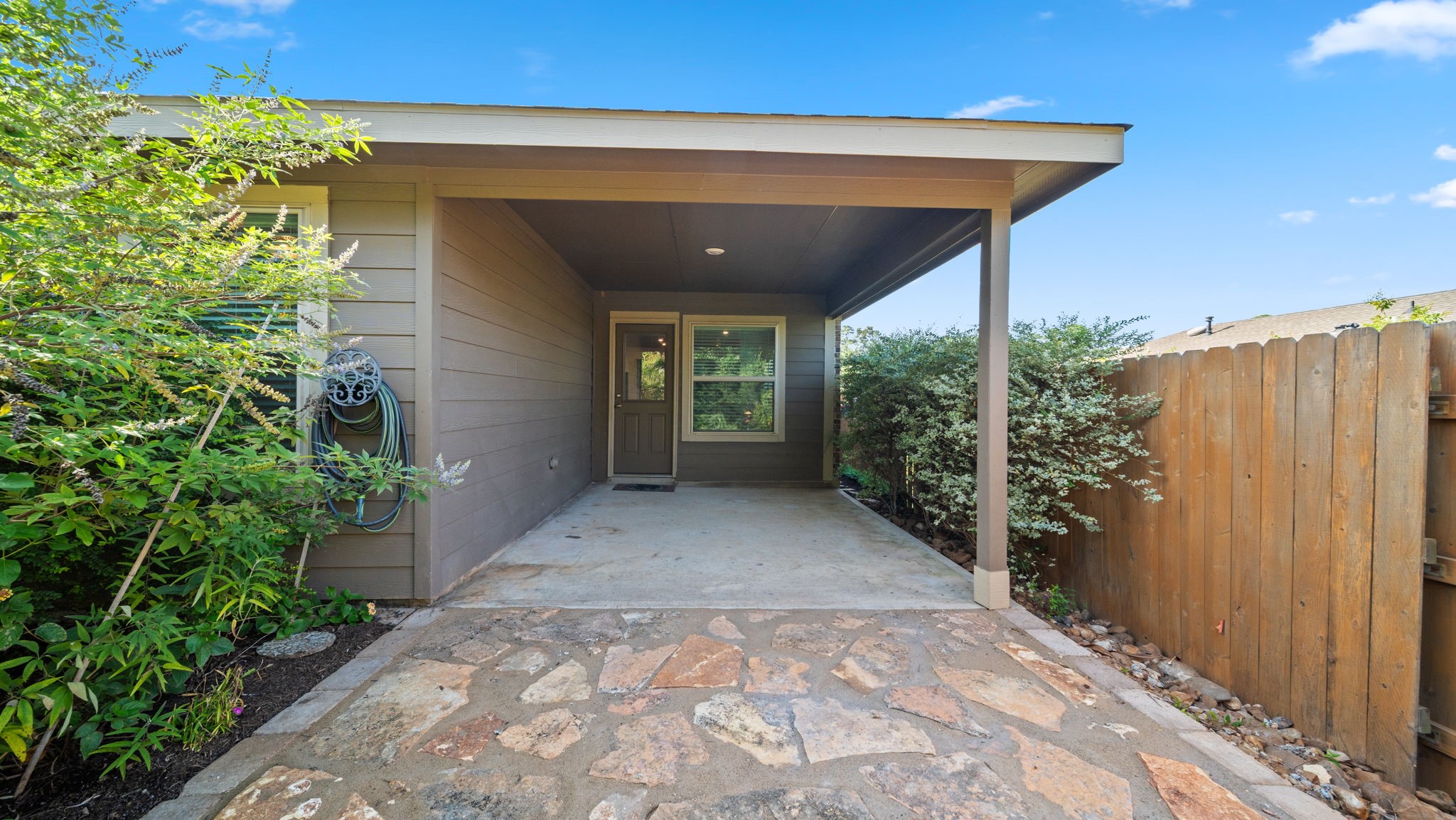 12348 Delta Timber Road Conroe, TX 77304 - Photo 21 of 22 The expansive covered patio extends your living space outdoors, offering the perfect setting for morning coffee, weekend barbecues, or relaxing while overlooking the beautifully landscaped backyard.