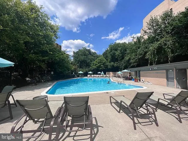 a view of a patio with chairs and tables