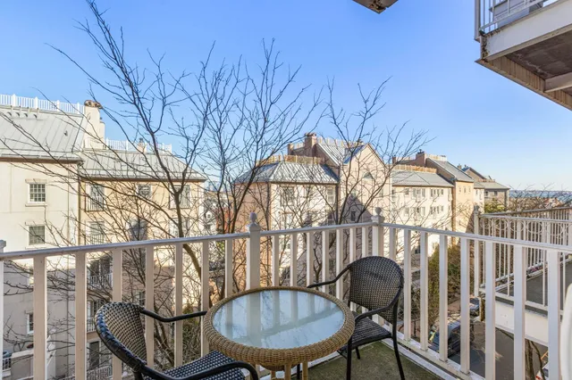 a view of a chairs and table in the patio