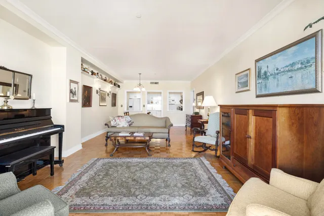 a living room with furniture and a rug