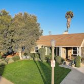 a aerial view of a house with a yard