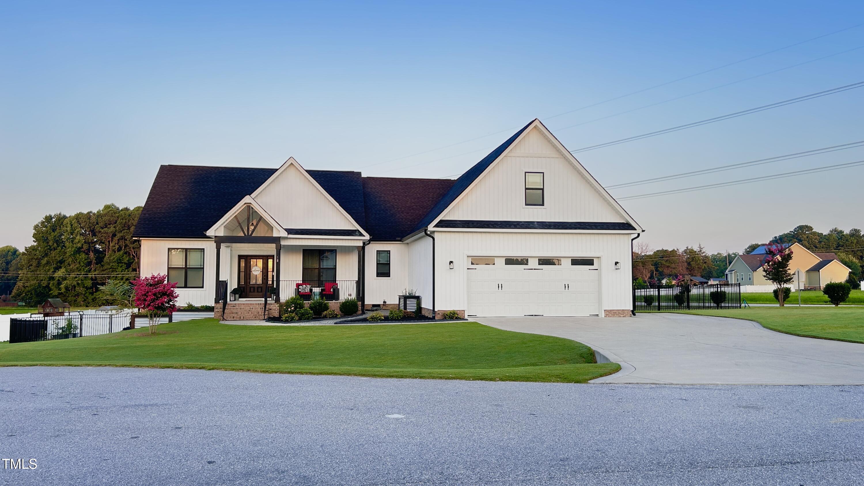 a view of house with yard and green space
