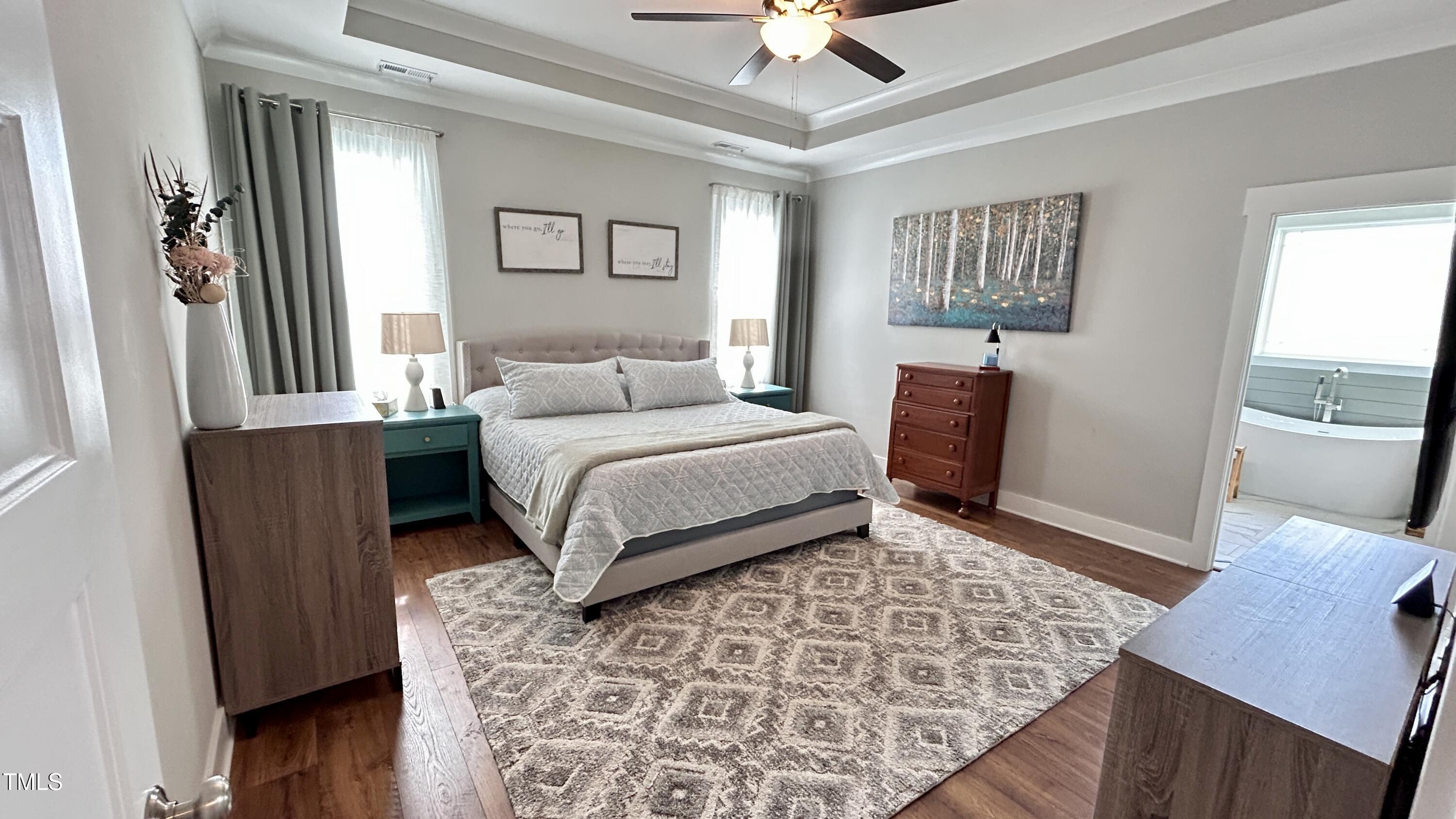 18 Pawnee Place Willow Spring, NC 27592 - Photo 17 of 35 a bedroom with a large bed and a window