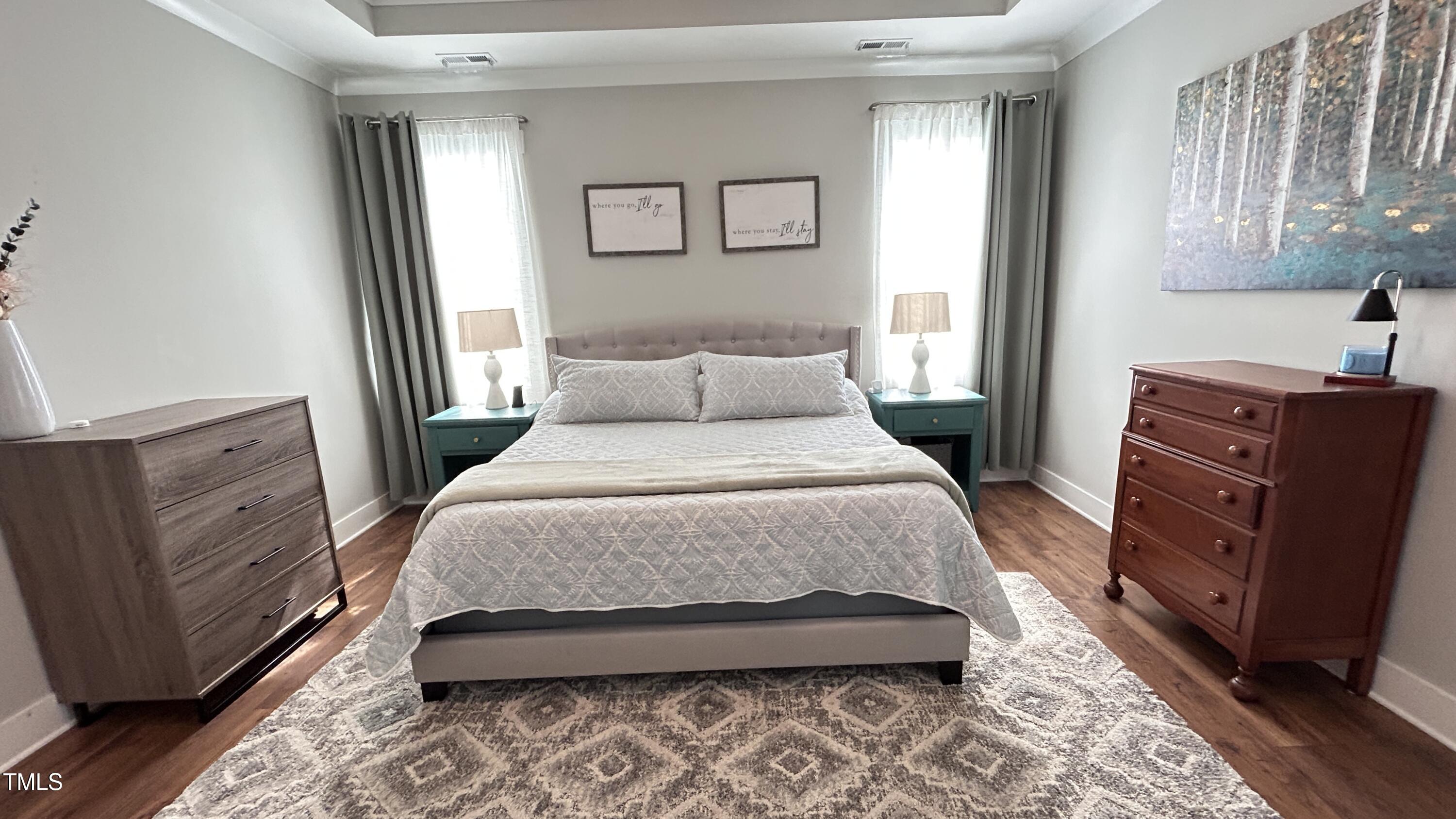 18 Pawnee Place Willow Spring, NC 27592 - Photo 18 of 35 a bedroom with a bed and wooden floor