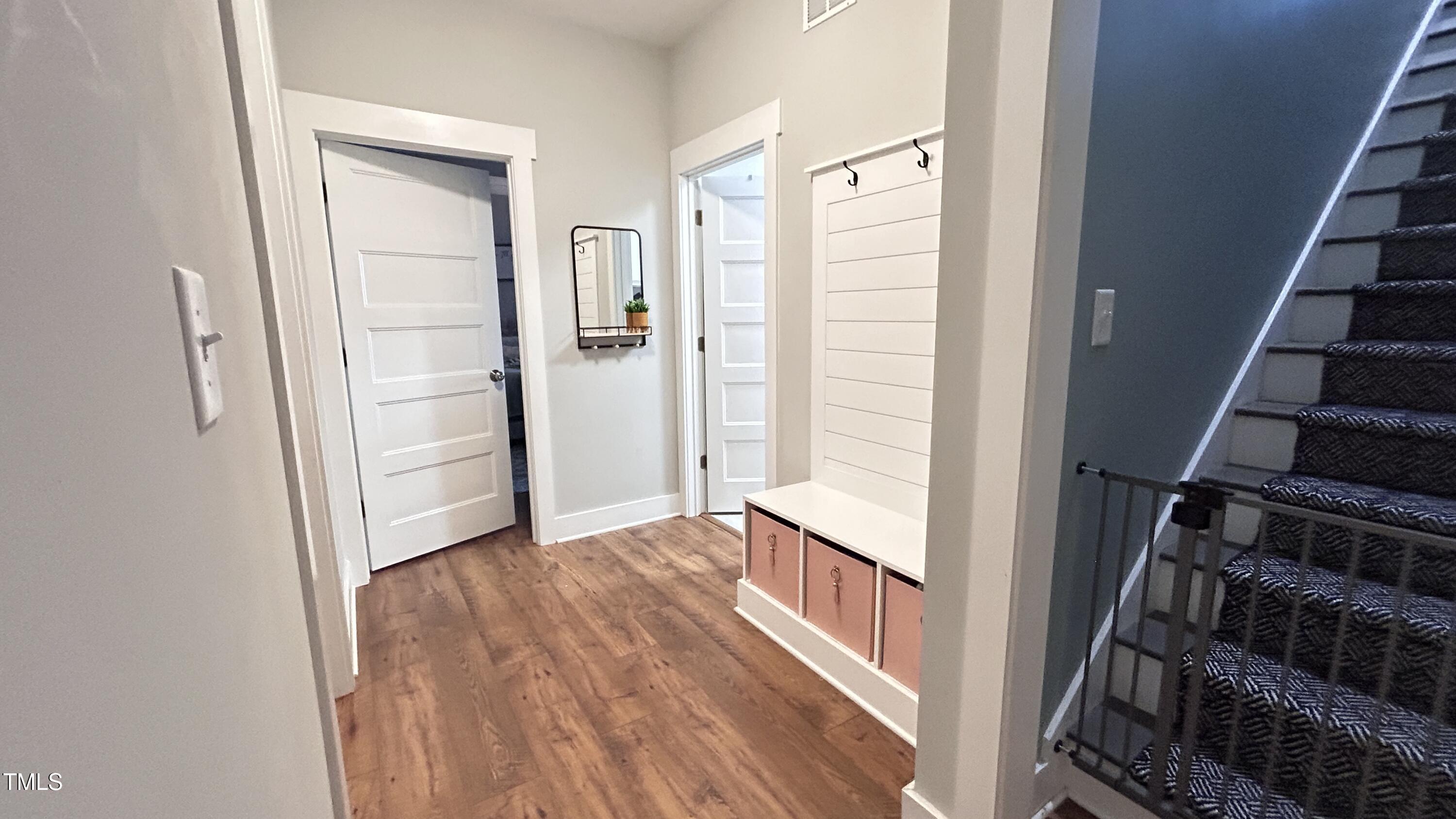 18 Pawnee Place Willow Spring, NC 27592 - Photo 23 of 35 an entryway with wooden floor and stairs