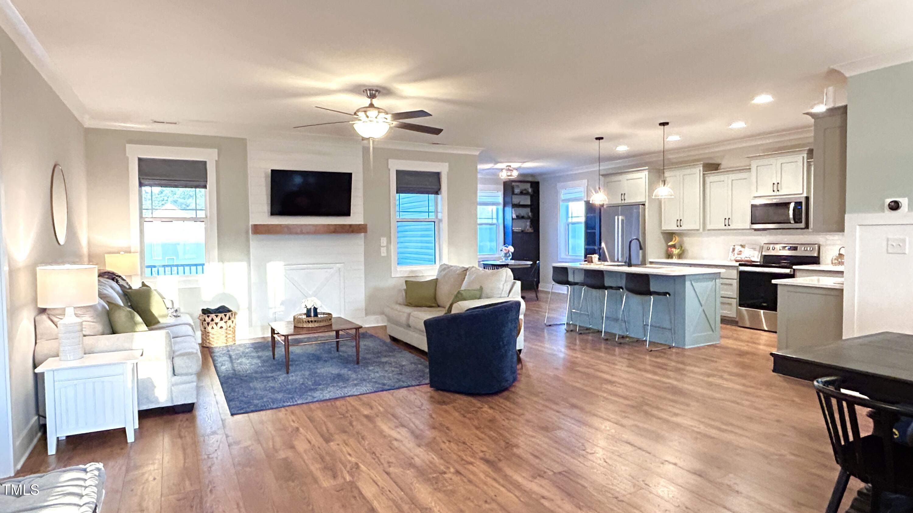 18 Pawnee Place Willow Spring, NC 27592 - Photo 3 of 35 a living room with furniture and a wooden floor