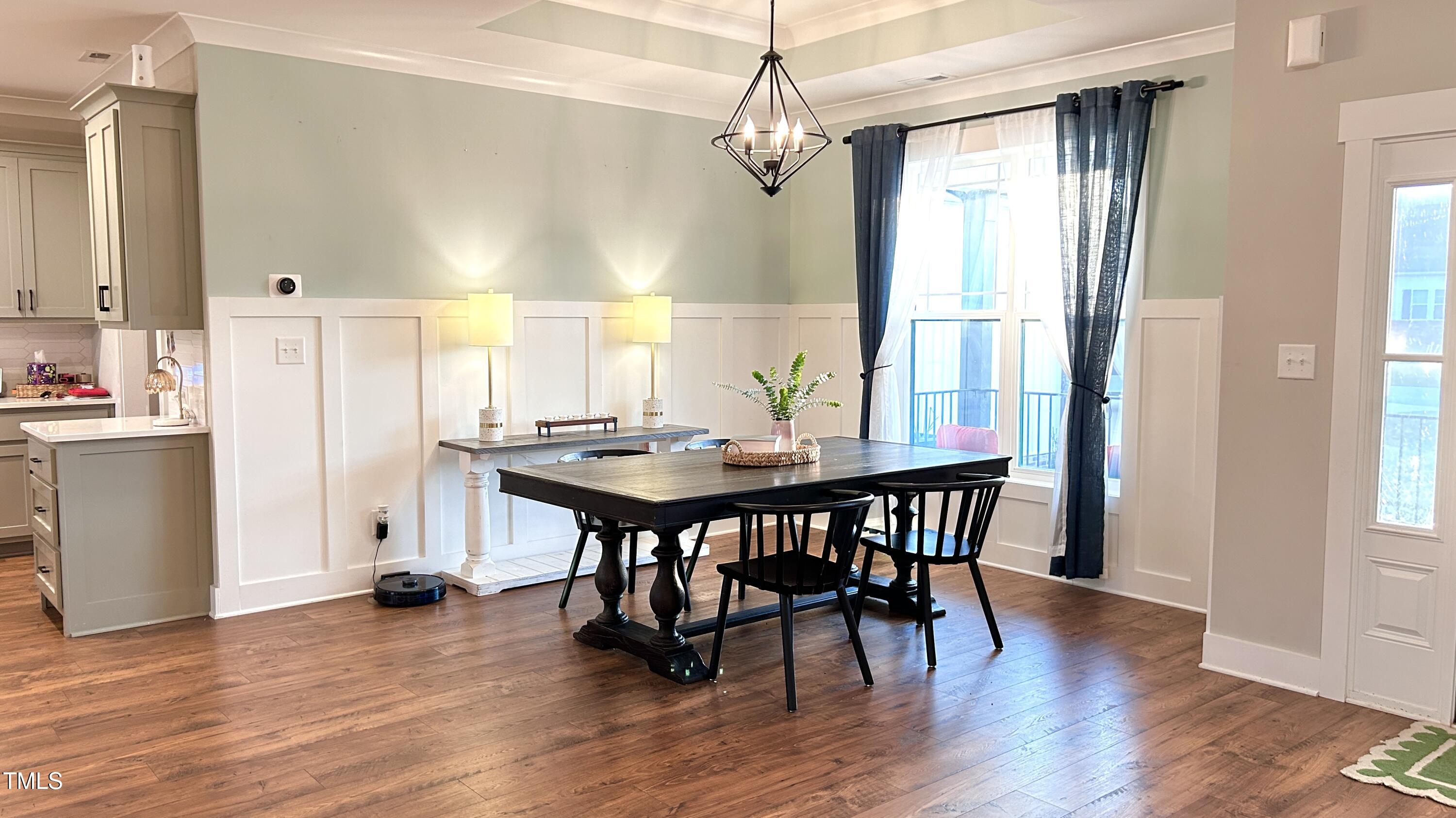 18 Pawnee Place Willow Spring, NC 27592 - Photo 5 of 35 a view of a dining room with furniture window and wooden floor
