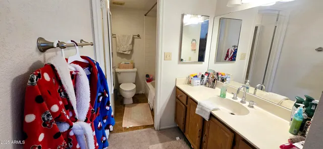a bathroom with a sink vanity and a mirror