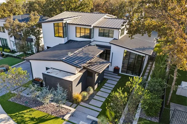 a aerial view of a house with a yard