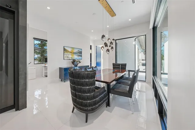 a living room with furniture a rug and white walls