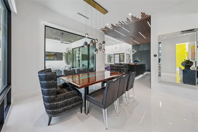 a view of a livingroom with furniture and a potted plant