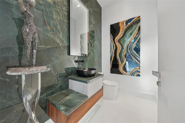 a bathroom with a sink a mirror and shower