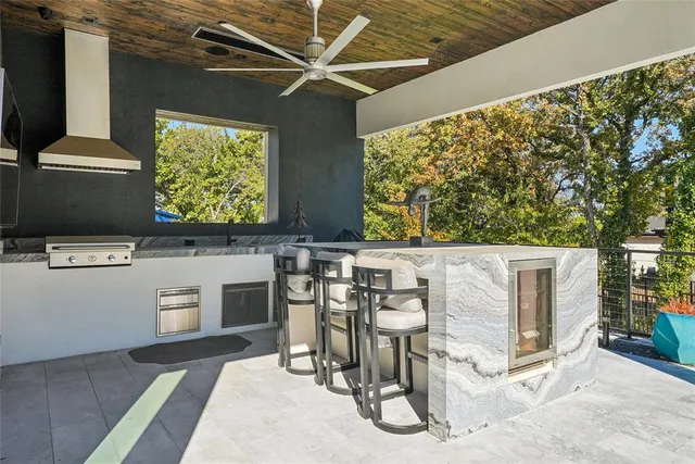 a view of a porch with furniture and a flat screen tv