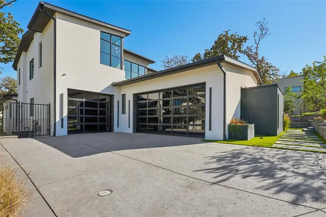 a view of a house with a backyard and porch