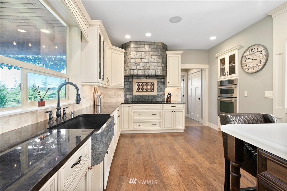 5745 Barr Road Ferndale, WA 98248 - Photo 11 of 40 a large kitchen with stainless steel appliances granite countertop a sink and a stove