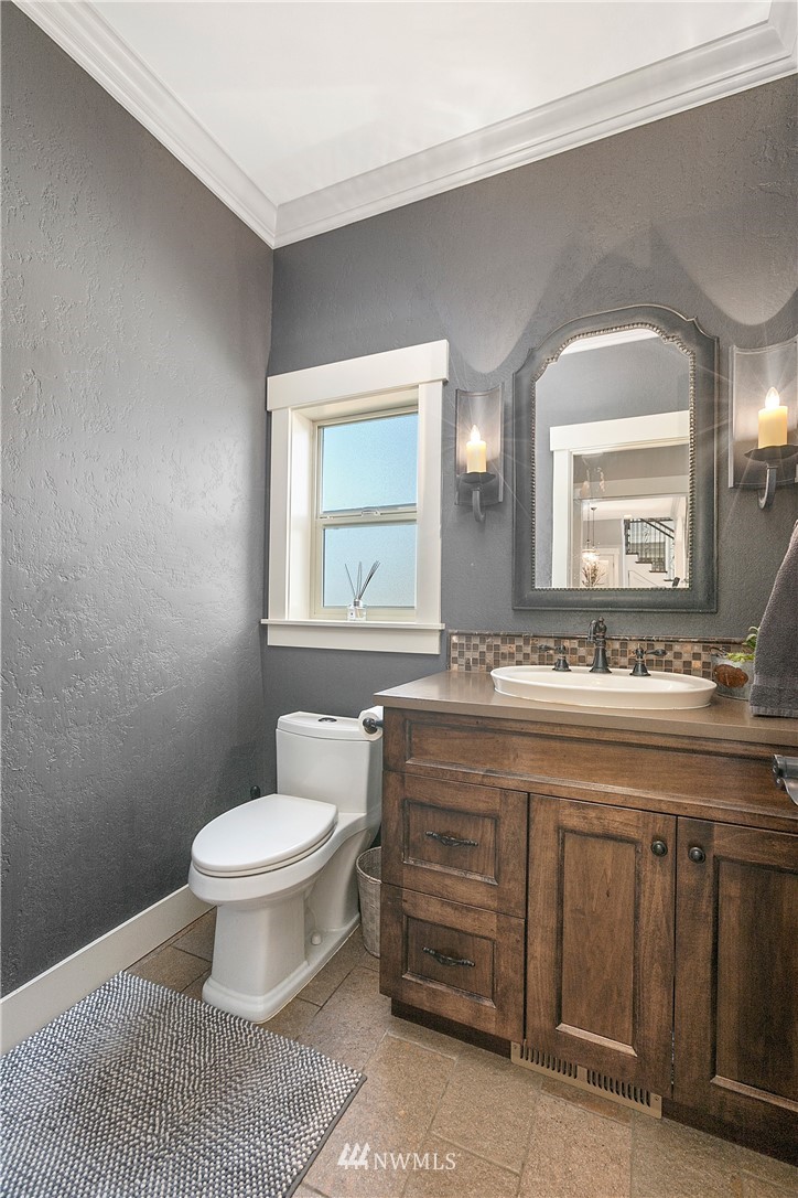 5745 Barr Road Ferndale, WA 98248 - Photo 12 of 40 a bathroom with a granite countertop toilet a sink and a mirror
