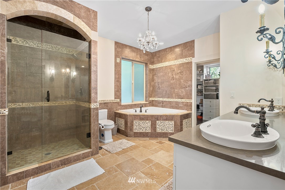 5745 Barr Road Ferndale, WA 98248 - Photo 17 of 40 a spacious bathroom with a tub shower and sink