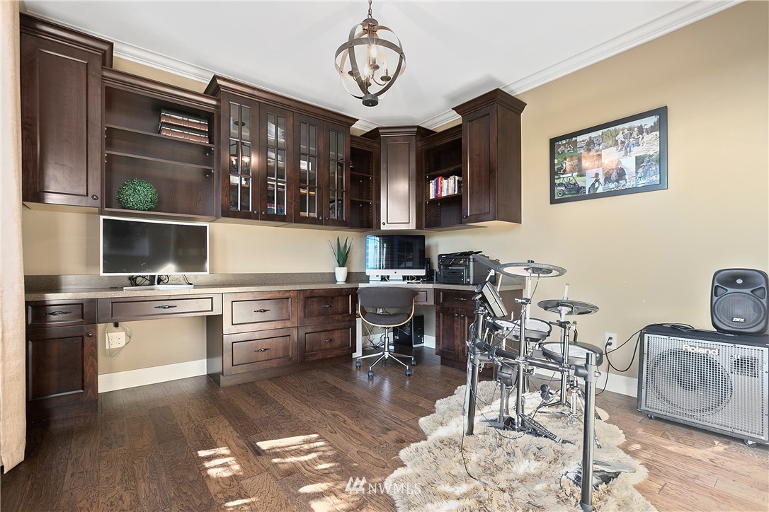 5745 Barr Road Ferndale, WA 98248 - Photo 18 of 40 a kitchen with stainless steel appliances granite countertop a stove top oven a sink a dining table and chairs with wooden floor