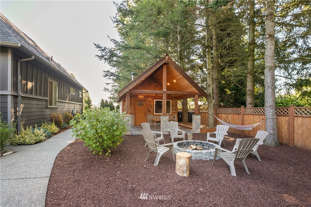 5745 Barr Road Ferndale, WA 98248 - Photo 27 of 40 a view of a patio with table and chairs and potted plants