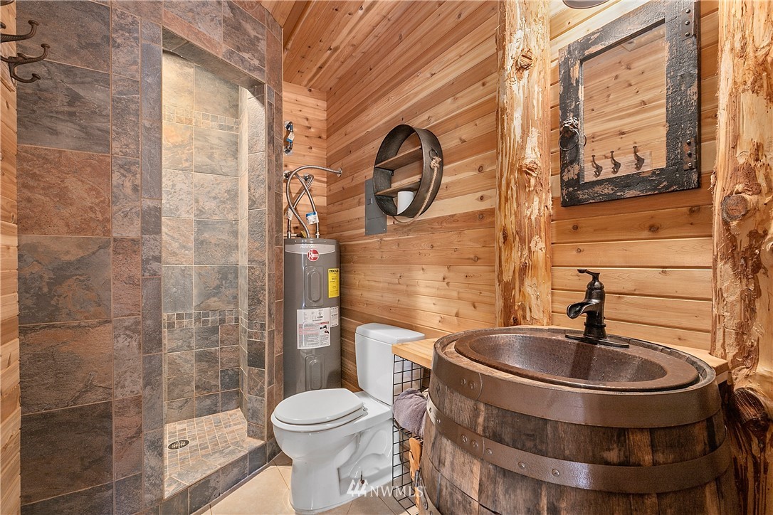 5745 Barr Road Ferndale, WA 98248 - Photo 30 of 40 a bathroom with a toilet sink and mirror
