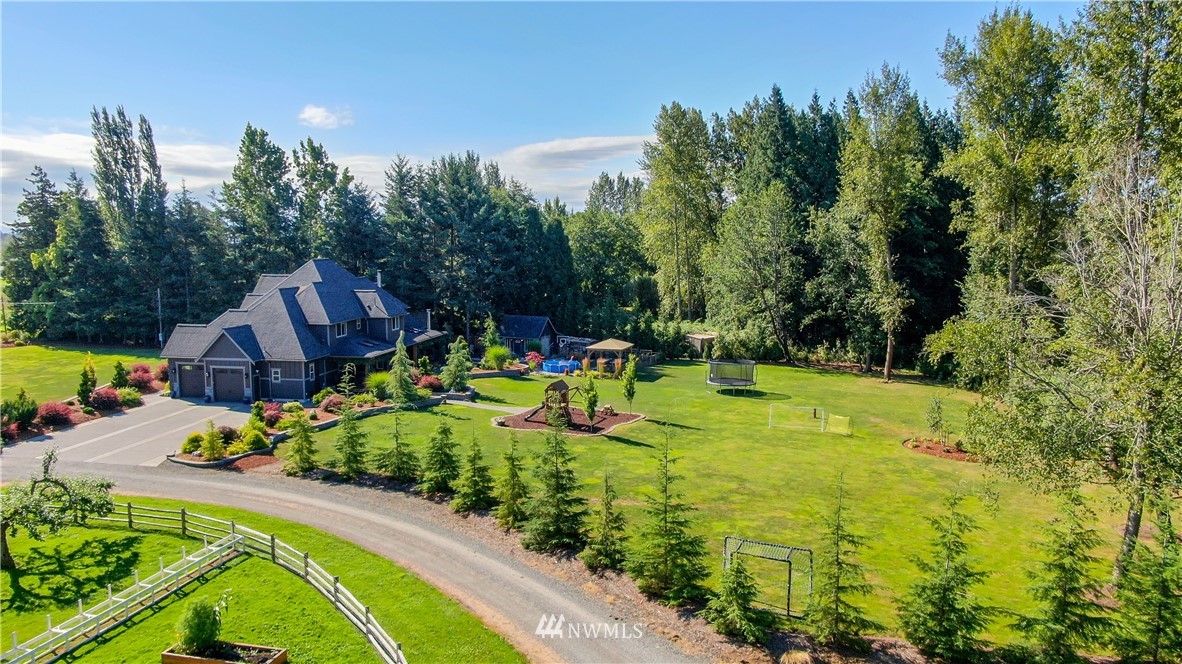 5745 Barr Road Ferndale, WA 98248 - Photo 35 of 40 a view of a swimming pool with a garden