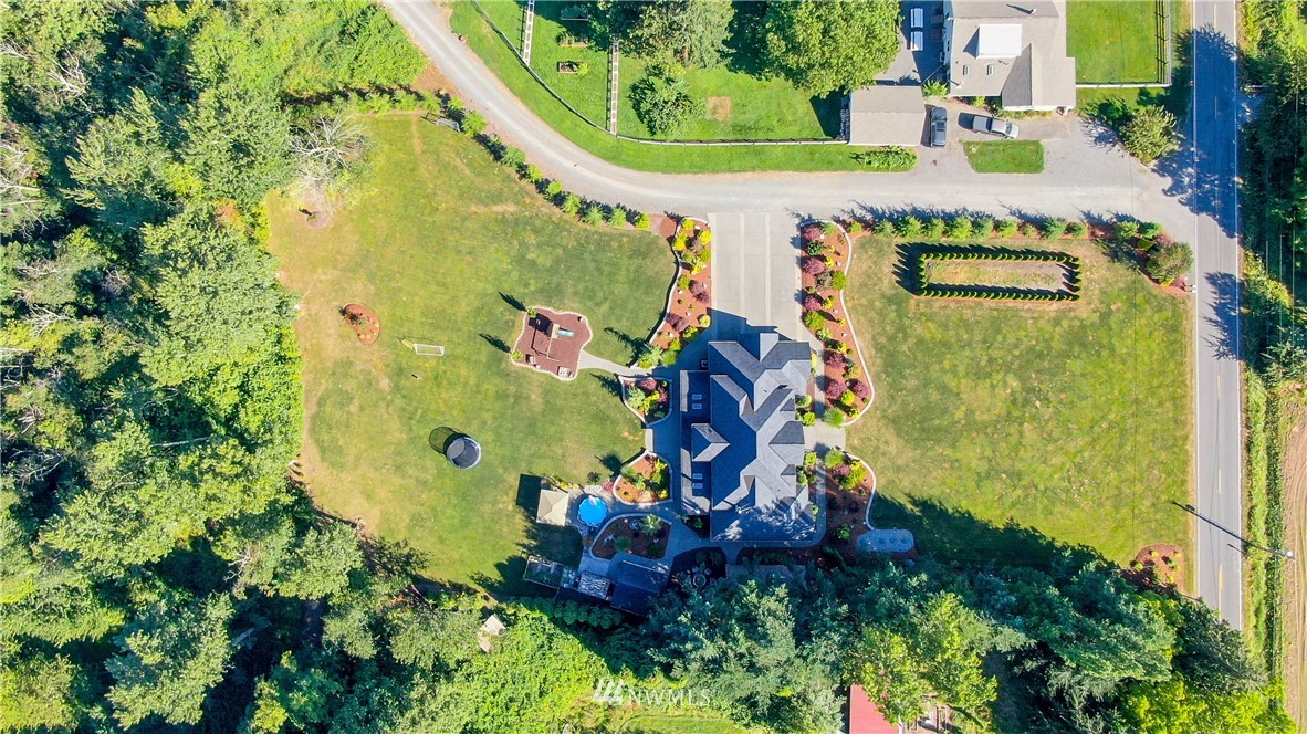 5745 Barr Road Ferndale, WA 98248 - Photo 38 of 40 an aerial view of a house with a yard and greenery