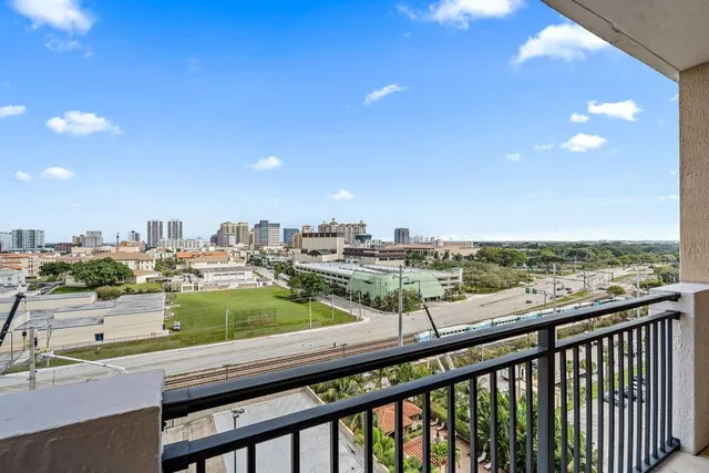 a view of a city from a balcony with city view