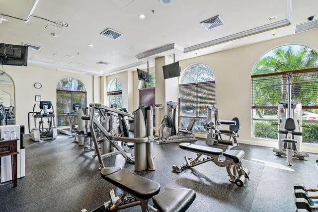a view of a livingroom with dining room and wooden floor
