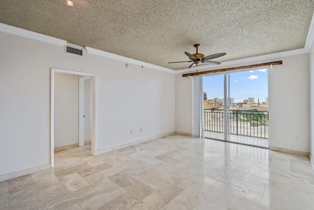 a view of a livingroom with a furniture and a ceiling fan