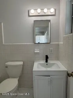 a kitchen with stainless steel appliances a refrigerator sink and cabinets