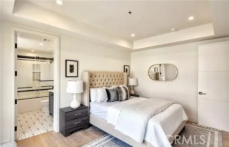 a bedroom with a bed and a night stand